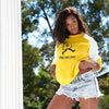Yellow sweatshirt with white sleeve and blue arm patch accent